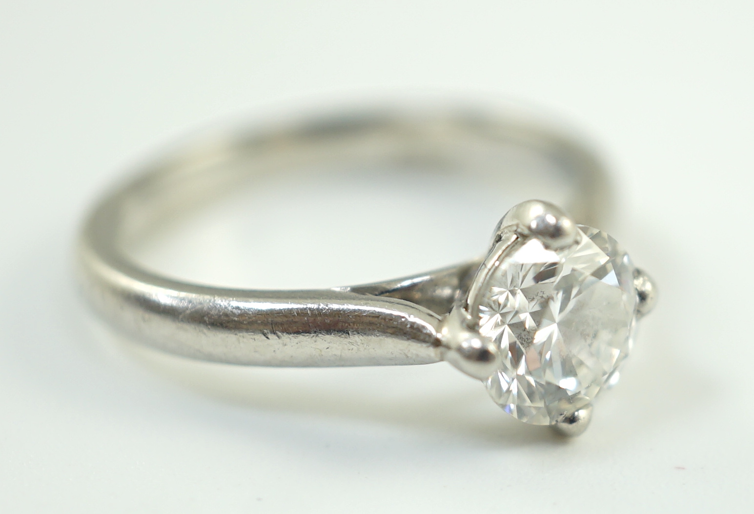 A modern platinum and solitaire diamond set ring